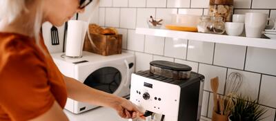 A person using a coffee maker