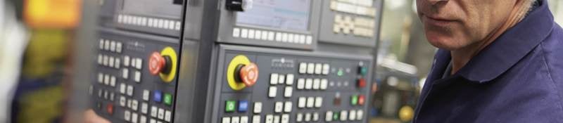 Technician working on an industrial control panel