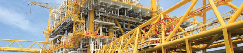 Yellow oil platform on the water