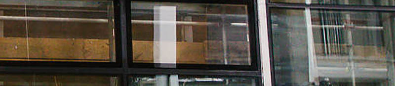 Man and woman in hardhats talking at Northbrook's fenestration laboratory