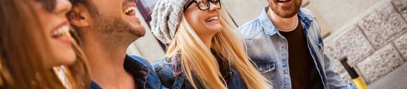 Friends out for a walk wearing glasses and sunglasses