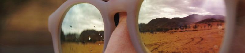 Woman with sunglasses looking at mountains