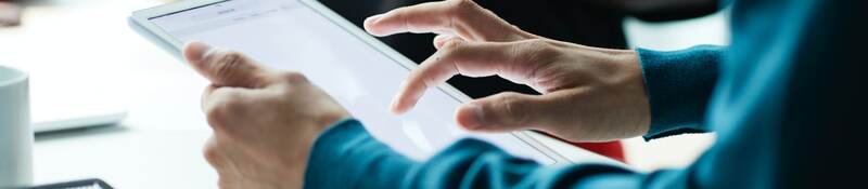 Person holding a tablet meeting with a customer