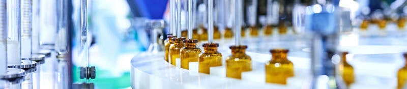 Glass medicine bottles on a factory line