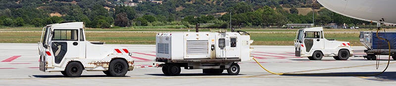 Baggage tractor-trailers on the tarmac
