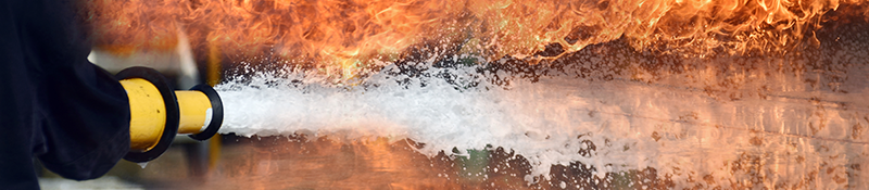 Firehose extinguishing a flame