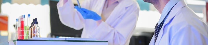 A man and a woman in a laboratory