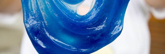 blue slime oozes and stretches