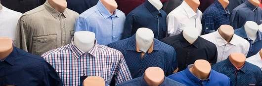 66518597 - the range of men's shirts on mannequins in the market (selective focus)