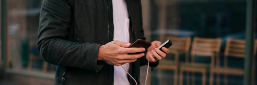 Connected device being held by man