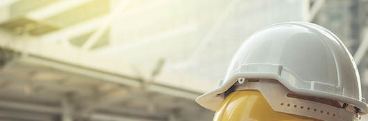 Image of yellow and white hard hats.