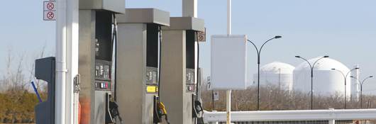 Three pumps at a gas station. 