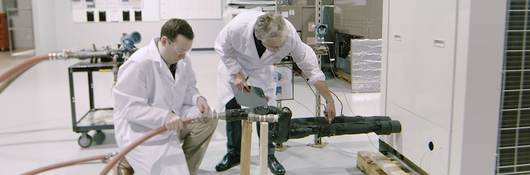 Two UL engineers testing an HVAC unit in a laboratory