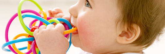 Baby playing with a teething toy 