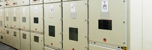 A picture of power distribution equipment inside a power plant. 