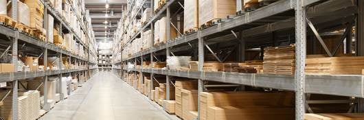 Row of shelves with boxes in warehouse