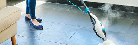 Steam cleaner mop cleaning a floor