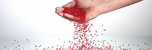 Hand catching plastic pellets