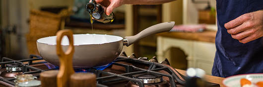 Man cooking on stove top.