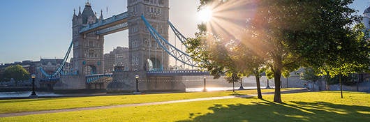 View of London bridge with sun rays in the background.