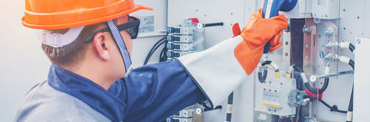 Engineer working on equipment and performing maintenance in a solar power plant