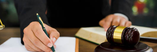 Man signing legal document