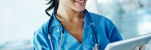 Nurse looking at a tablet