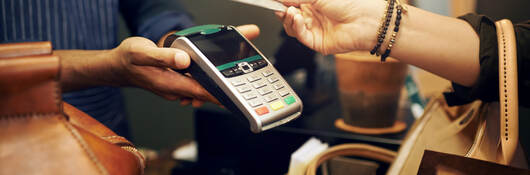 woman holding a credit card for payment