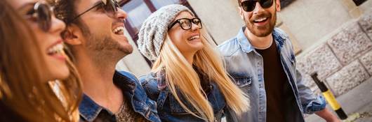 Friends out for a walk wearing glasses and sunglasses