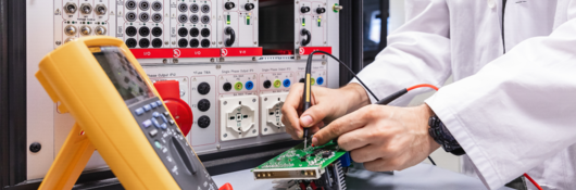 Engineer conducting electrical safety and performance tests 