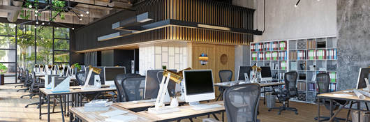 Row of empty desks in a modern office