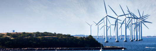 Wind turbines at sea with boat