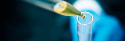 Chemical being added to a beaker