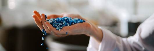 Hand inspecting plastic pellets