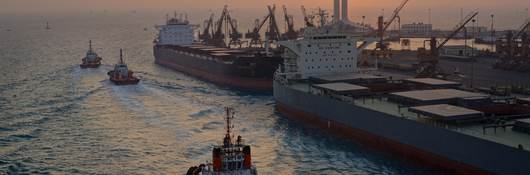 Tugs and freighter boats moored along the wharf in Saudi Arabia