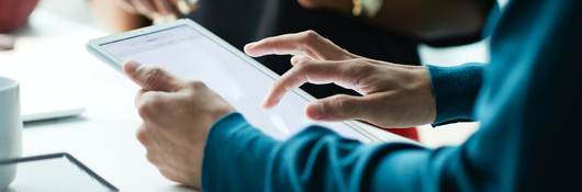 Person holding a tablet meeting with a customer