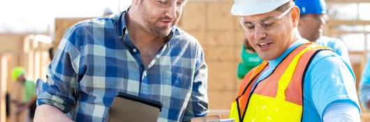 Construction managers discuss building plans