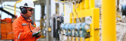 Worker checking gas pipes