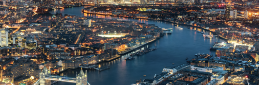 High Angle View Of Tower Bridge Over Thames River In Illuminated City At Night