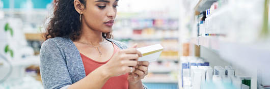 Shopper reading the ingredients on a product 