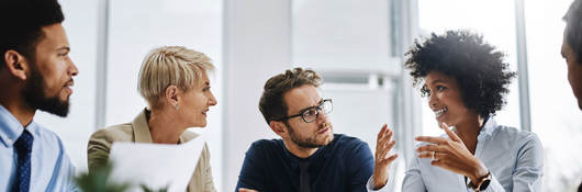 A group of businesspeople sitting together in a meeting.