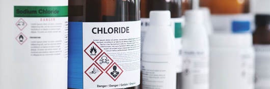 common lab chemicals - bottles of chemicals on a shelf in a lab
