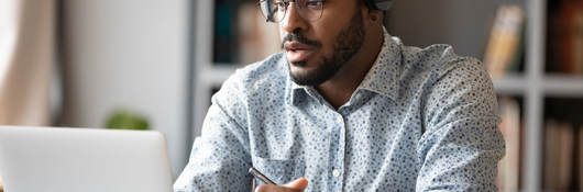Focused business person watching webinar