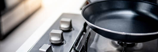 Black pots on a gas stove