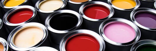 Several full cans of paint
