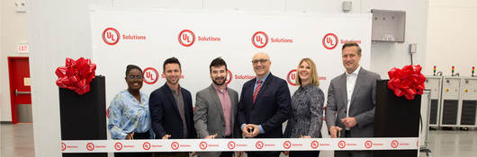 UL Solutions team cutting a ribbon