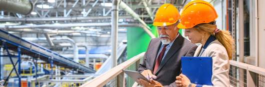 Manager and quality controller inside recycling facility.