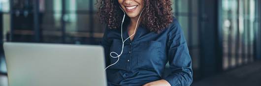 Person smiling while having an online meeting