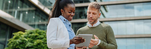 A couple working together on a tablet