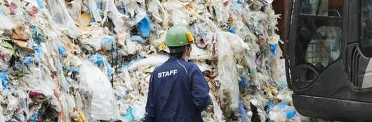 Workers at an industrial waste treatment facility.